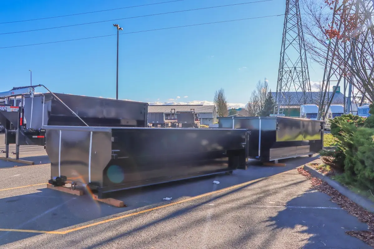 Roll-off dumpster ready for waste disposal at job site for Concrete Dumpster Rental in Manchester